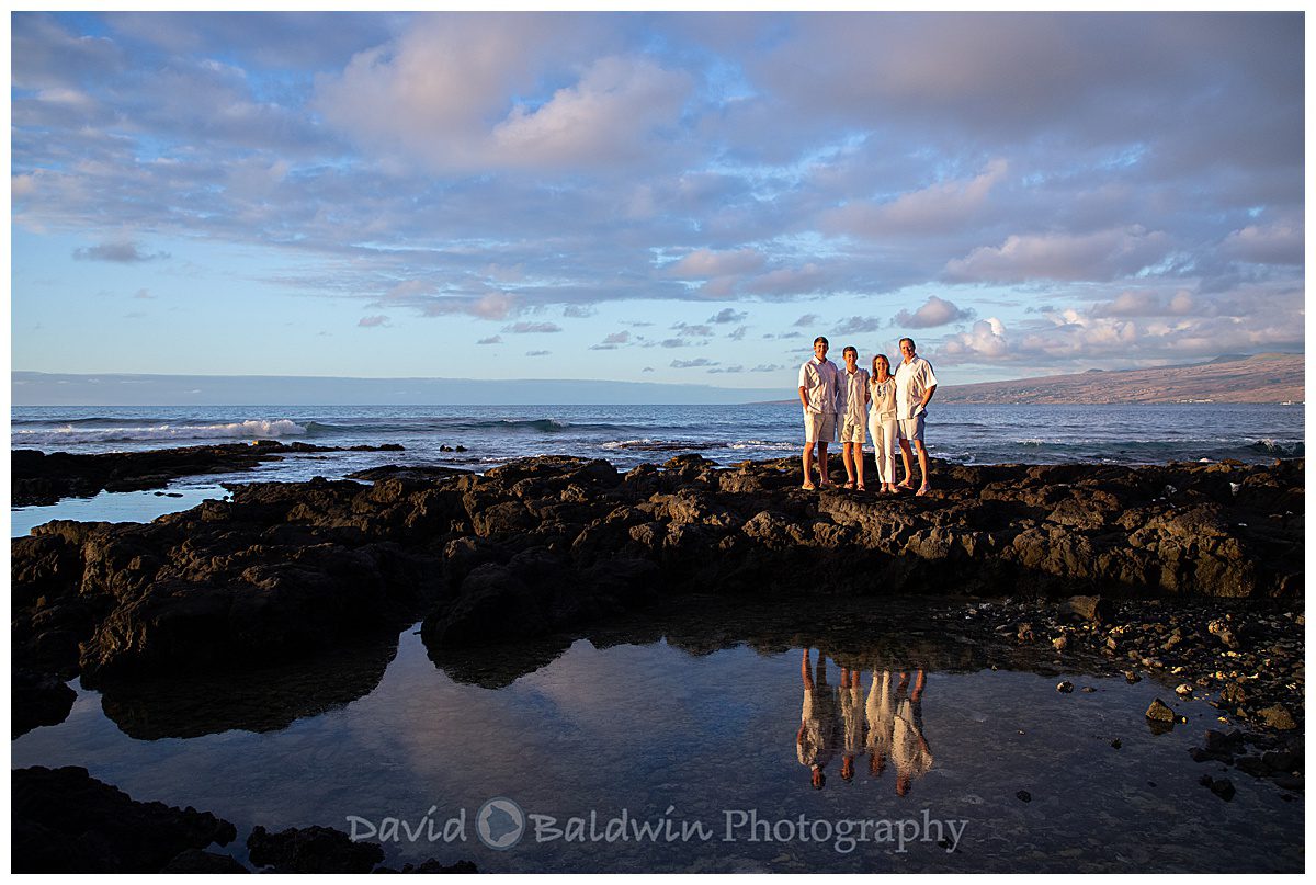 reflection shot of family at a tide pool in Hawaii